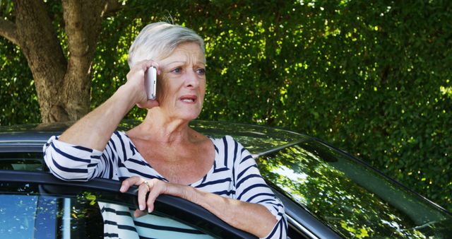 Worried Senior Woman Talking on Phone Next to Car - Download Free Stock Images Pikwizard.com