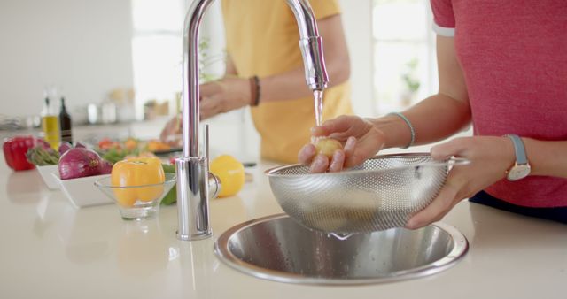 Washing Fresh Vegetables in Modern Kitchen - Download Free Stock Images Pikwizard.com