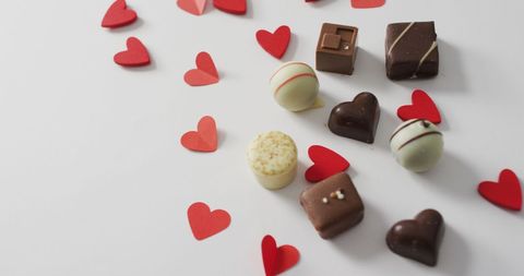 Valentine's Day Spread with Chocolates and Red Hearts - Download Free Stock Images Pikwizard.com