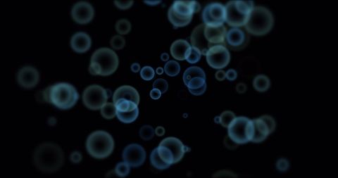 Glowing Blue Bubbles on Dark Background