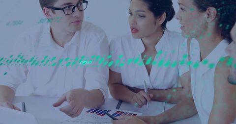 Business team discussing analytics with digital data overlay