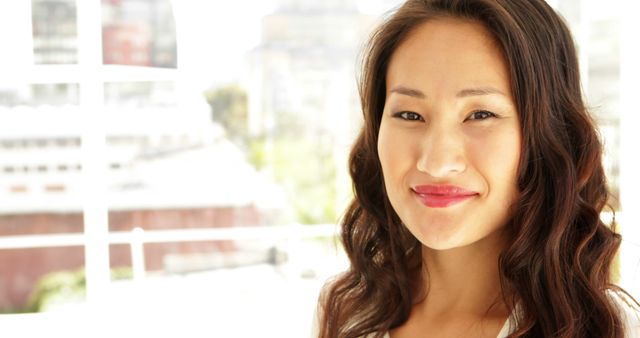 Smiling Young Woman with Long Hair in Bright Room - Download Free Stock Images Pikwizard.com