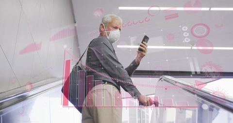 depicts senior man in a public space using smartphone while wearing face mask, emphasizing cautious engagement with technology during pandemic. digital data graphics suggest focus on analytical professions or tracking health statistics. useful for healthcare publications or technology blogs discussing safety and data use during pandemics.