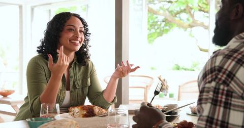 Couple Enjoying Relaxed Meal on Sunny Outdoor Patio