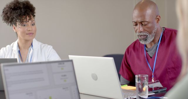 Multi-ethnic Medical Team Collaborating On Project With Laptops - Download Free Stock Images Pikwizard.com