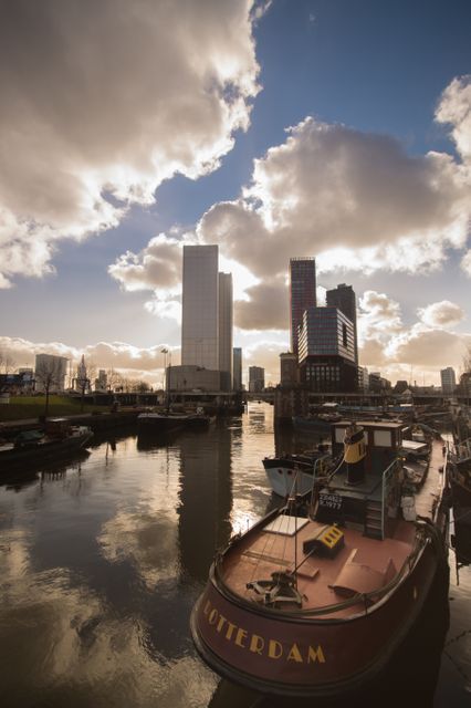 Harbor Scene in Rotterdam with Modern Skyline and Cloudy Sky - Download Free Stock Images Pikwizard.com