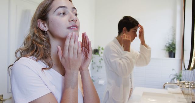 Couple Practicing Skincare Routine in Bathroom - Download Free Stock Images Pikwizard.com