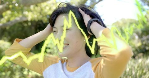 Woman Adjusting Headphones Outdoors with Fitness Tracker and Neon Waveform Overlay