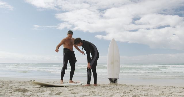 Surfing Instructor Guides Student on Beach with Decision Making Lesson - Download Free Stock Images Pikwizard.com