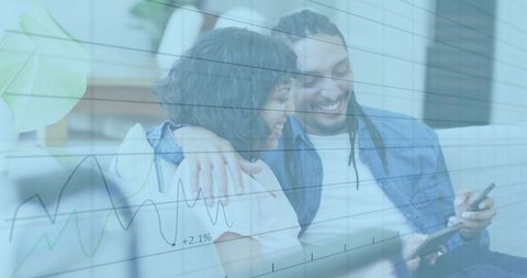 Smiling couple engaging with digital financial trends on smartphone
