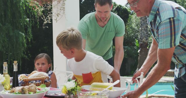 Family Preparing for Outdoor Meal in Garden - Download Free Stock Images Pikwizard.com