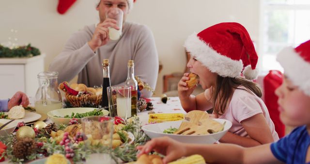 Family Enjoying Festive Christmas Dinner with Children in Santa Hats - Download Free Stock Images Pikwizard.com