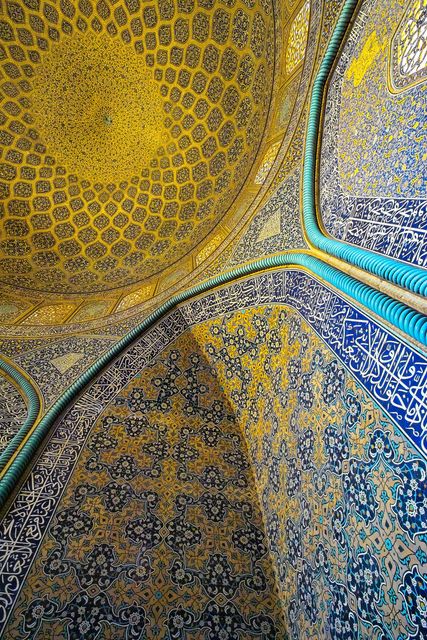 Features intricate geometric patterns and tile work in an Islamic architectural setting. Ideal for use in cultural publications, travel blogs, educational materials on art and architecture, or digital backgrounds emphasizing traditional design and cultural heritage.