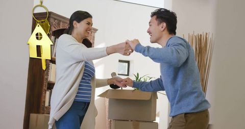 Joyful Couple Celebrating New Home Ownership with Dance - Download Free Stock Images Pikwizard.com