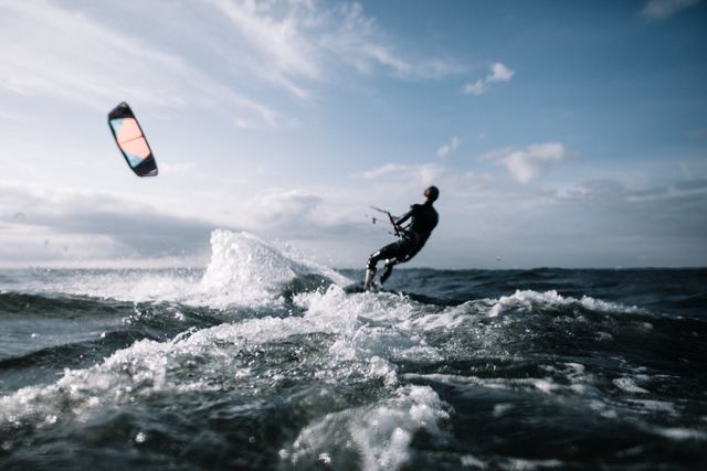 Kitesurfer Riding Waves in Open Ocean - Download Free Stock Photos Pikwizard.com
