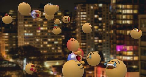 Floating Emoji Icons over Nighttime Cityscape