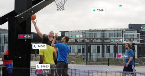 Leaping player driving layup with social media engagement overlays on urban outdoor court