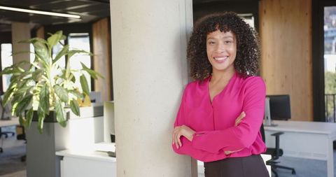 Confident Professional Woman Smiling in Modern Office
