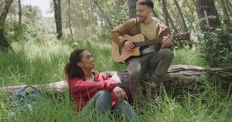 Couple Enjoying Outdoor Music in Sunny Woodland - Download Free Stock Images Pikwizard.com