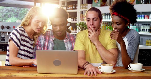 Diverse Group of Friends Sharing Ideas at Laptop in Coffee Shop - Download Free Stock Images Pikwizard.com