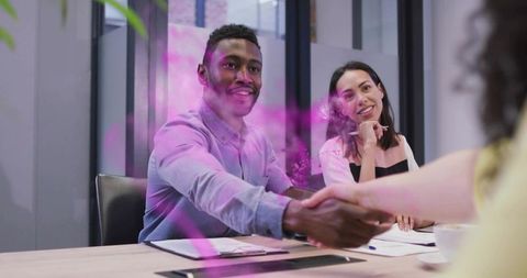 Business Handshake in Modern Meeting Room