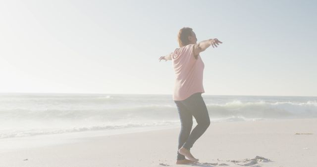 Woman Enjoying Freedom at Beach in Sunny Weather - Download Free Stock Images Pikwizard.com