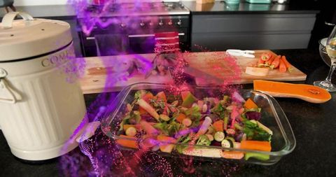 Preparing colorful roasted vegetables in glass baking dish with magenta smoke effect