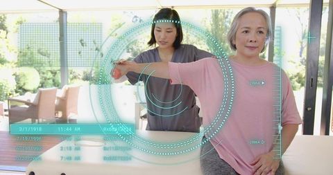 Therapist Guiding Senior Woman Through Arm Rehabilitation Using Augmented Reality HUD