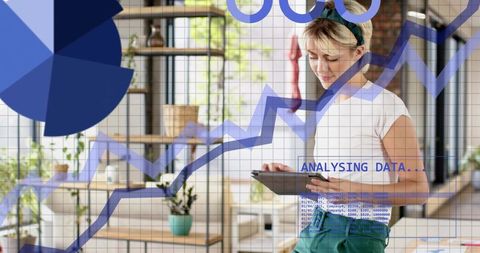 Woman holding tablet analyzing data with augmented charts and graphs in modern home