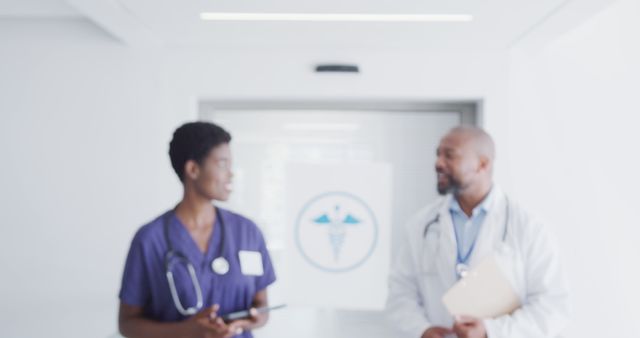 Healthcare Professionals Discussing Patient in Hospital Hallway - Download Free Stock Images Pikwizard.com