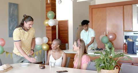 Group of friends socializing at home gathering