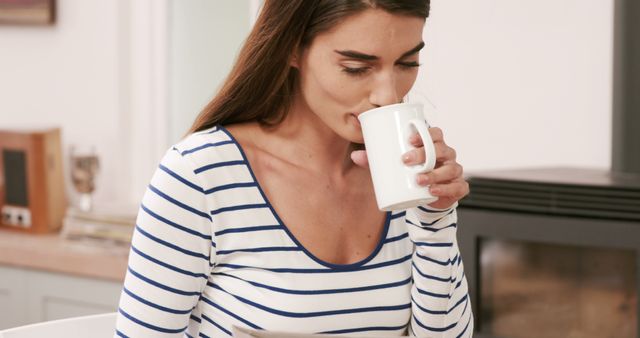 Woman Drinking Coffee at Home in Striped Shirt - Download Free Stock Images Pikwizard.com