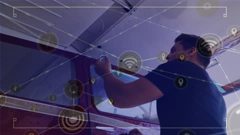 Technician Upgrading Antique Aircraft with IoT Technology