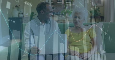 Senior Couple Analyzing Financial Data on Laptop at Home