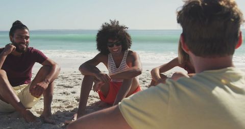 Diverse Friends Relaxing and Laughing on Sandy Beach - Download Free Stock Images Pikwizard.com
