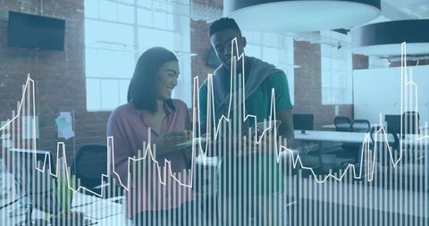 Business Professionals Analyzing Data with Technology in Modern Office Workspace