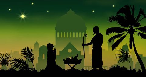 Traditional nativity scene with southern city silhouette