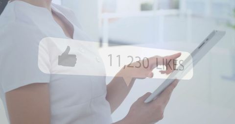 Woman Using Tablet Surrounded by Social Media Likes Notification