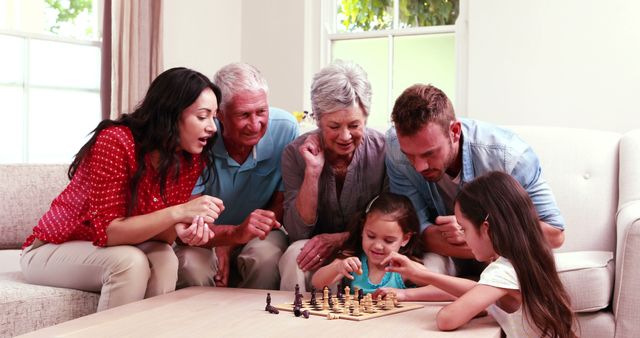 Multi-generational family enjoying chess game at home - Download Free Stock Images Pikwizard.com