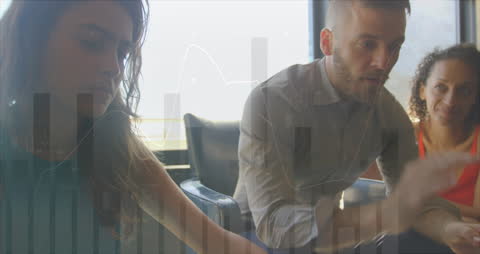 Diverse Professionals Collaborating with Digital Financial Analytics