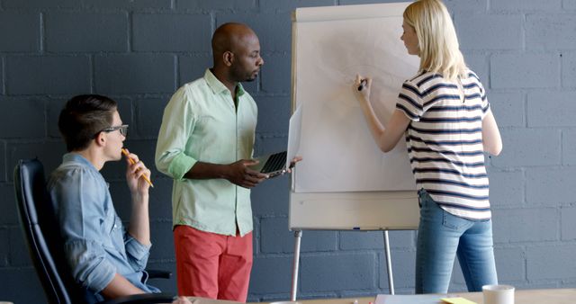 Diverse team brainstorming ideas on whiteboard in modern office - Download Free Stock Images Pikwizard.com