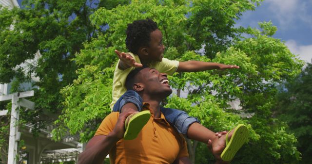 Father Giving Son Piggyback Ride Outdoors on a Sunny Day - Download Free Stock Images Pikwizard.com