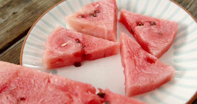 Close-up of Juicy Watermelon Slices on a Plate - Download Free Stock Images Pikwizard.com