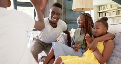 Happy Family Bonding on Couch at Home