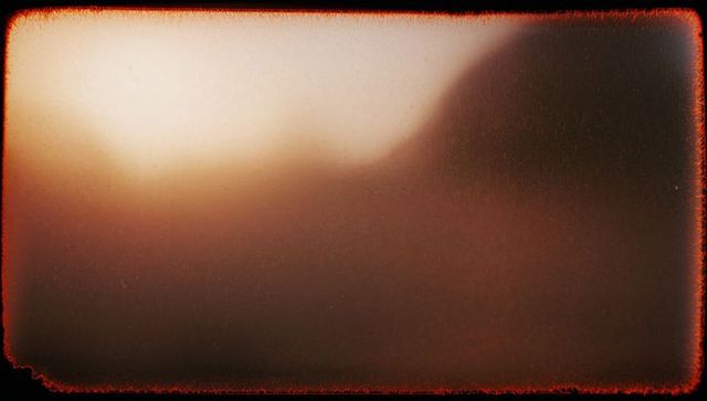 Cinematic moody texture in blurred warm-toned frame