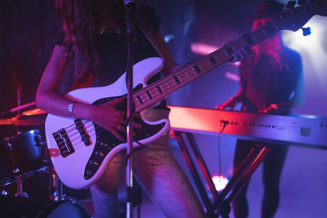 Females performing on illuminated in nightclub - Download Free Stock Photos Pikwizard.com
