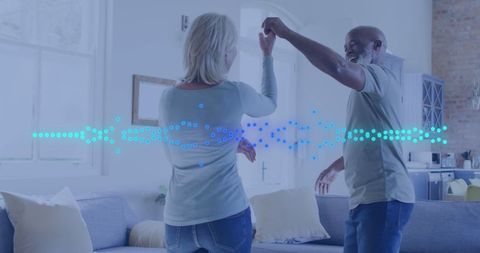 Happy Maturee Couple Dancing in Modern Living Room During Daytime