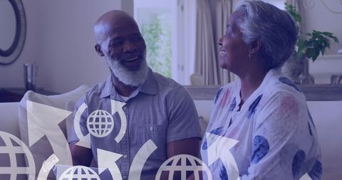 Happy Senior African American Couple Embracing Technology