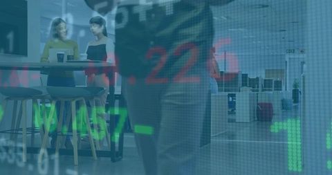 Young professionals collaborating in open office with stock market data overlay