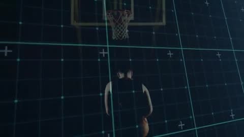 Basketball player walking toward hoop with digital grid overlay preparing jump shot
